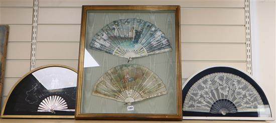 A framed pair of painted fans and two others, (three hand painted)